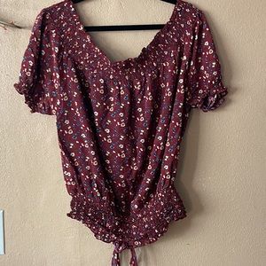 This is a cute burgundy ruched waist shirt. Perfect for fall